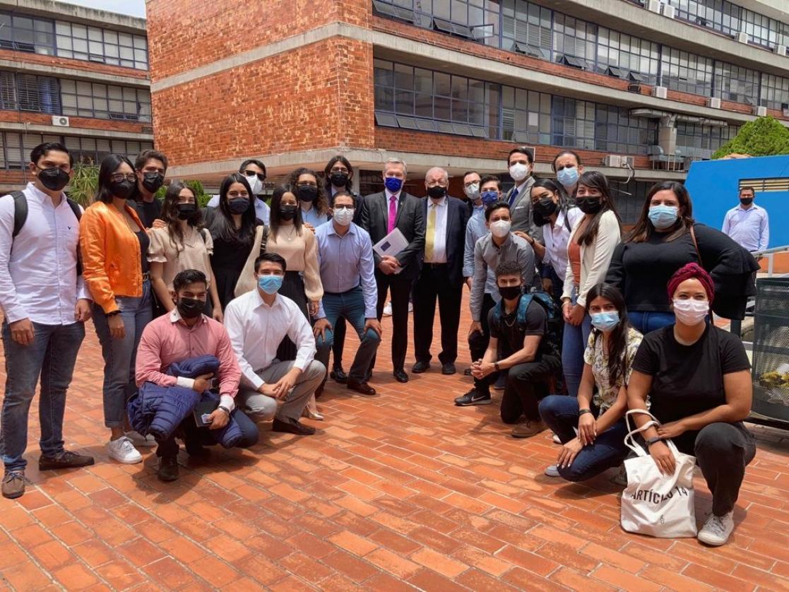 Group of young people taking a photo aout of the building