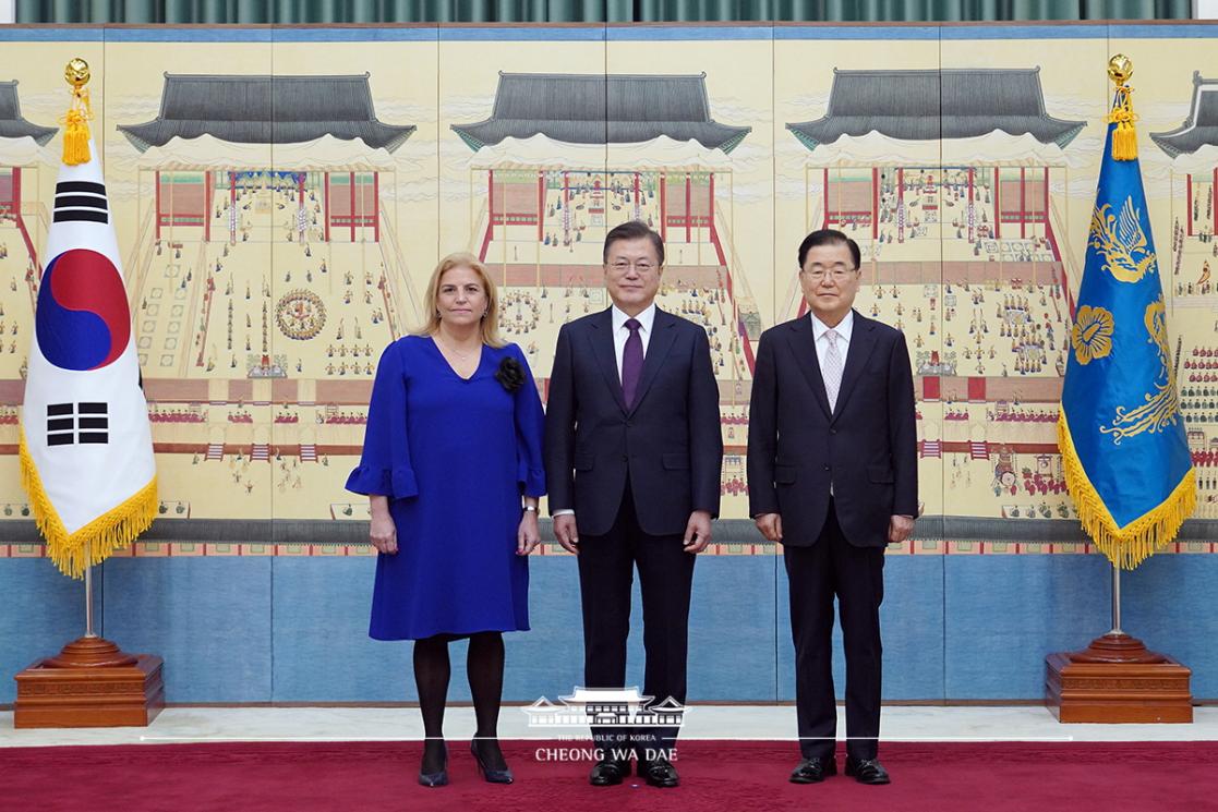 Three people at an institutional event