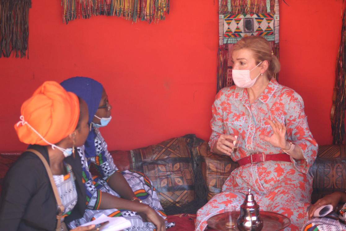 women sitting on carpets