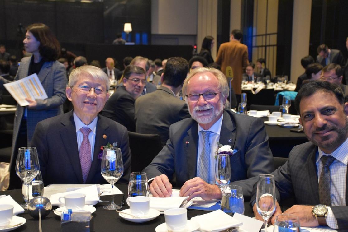Three men during an event
