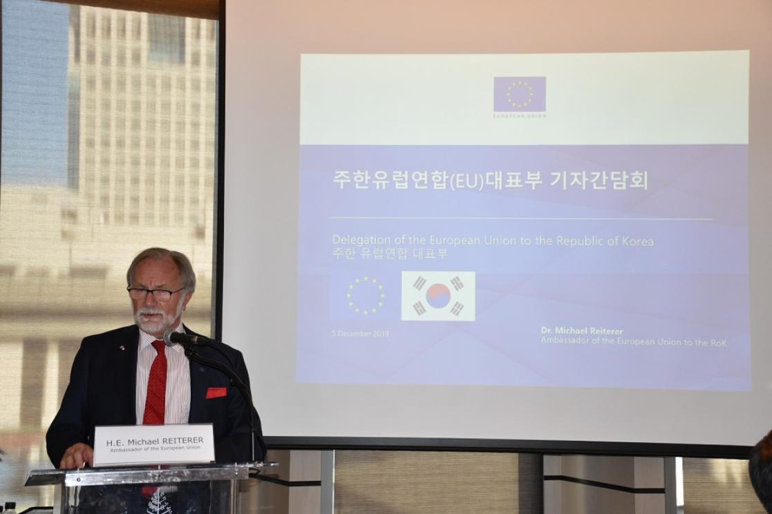 Man talking into a lectern