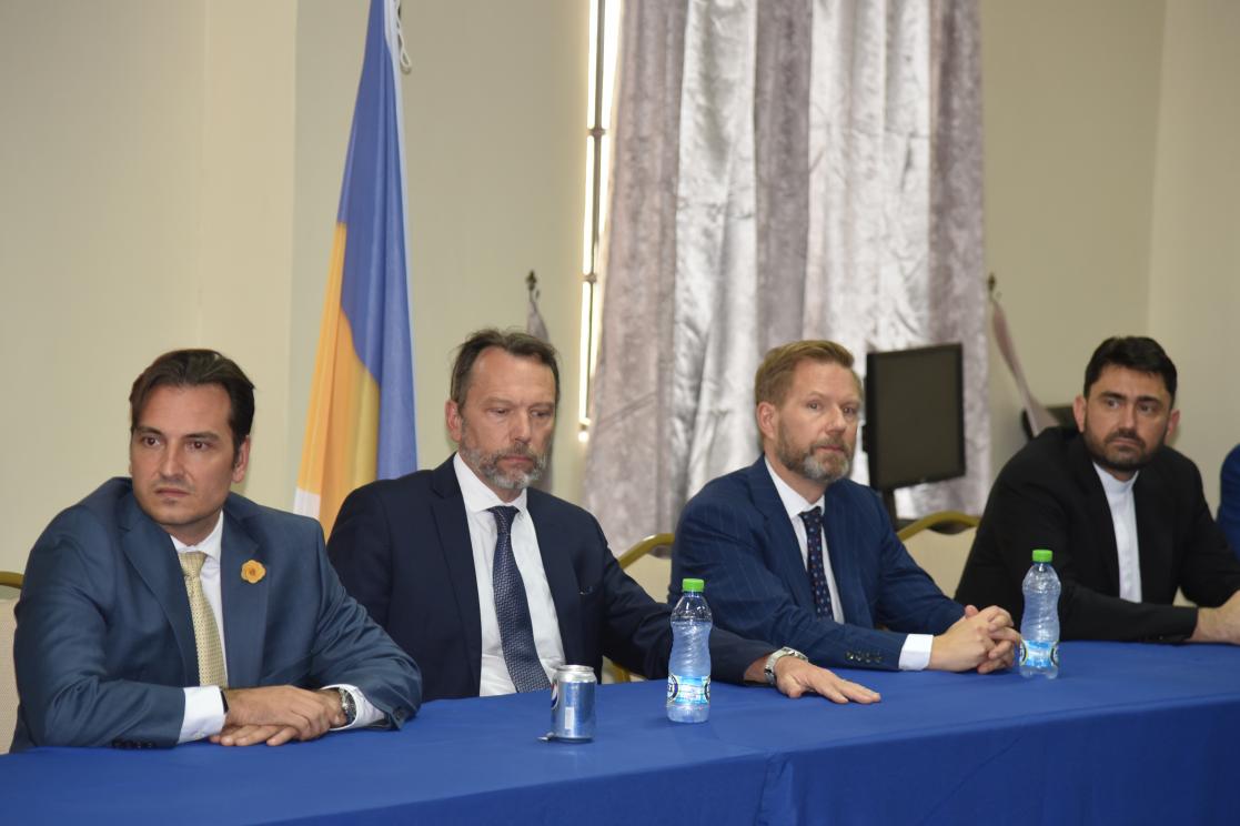 Four men during a press conference
