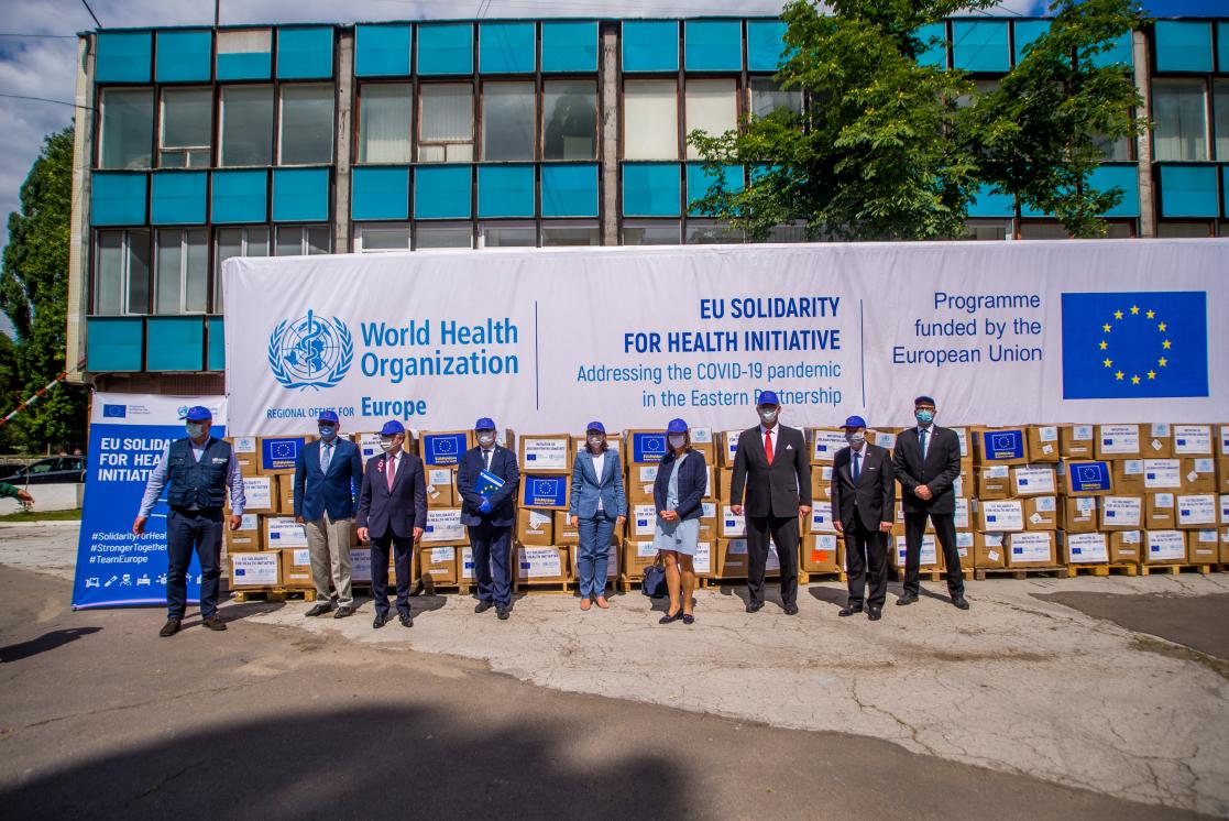 Family picture with boxes of material