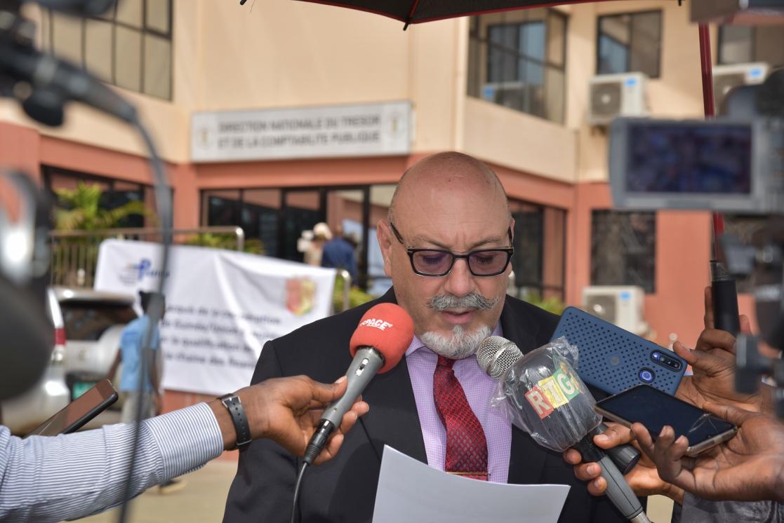 Man attending to the media