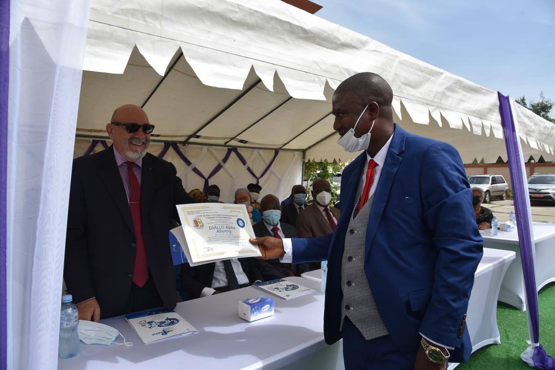 Two men with a diploma