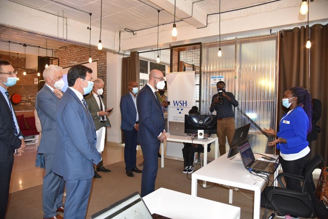 Group of people listening to a woman