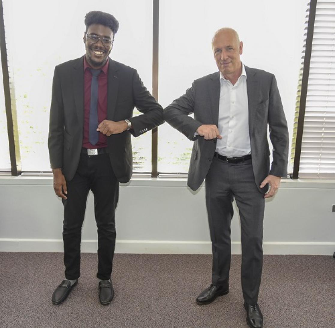 Two men greeting each other