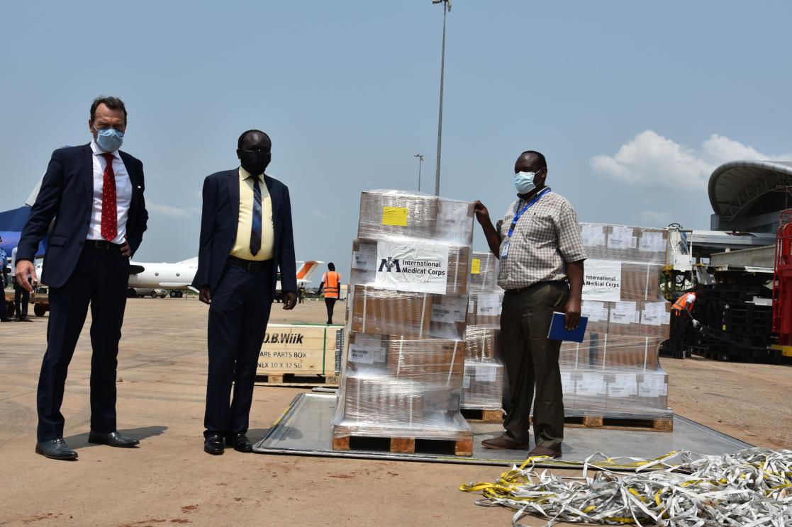 Group of people with boxes of material