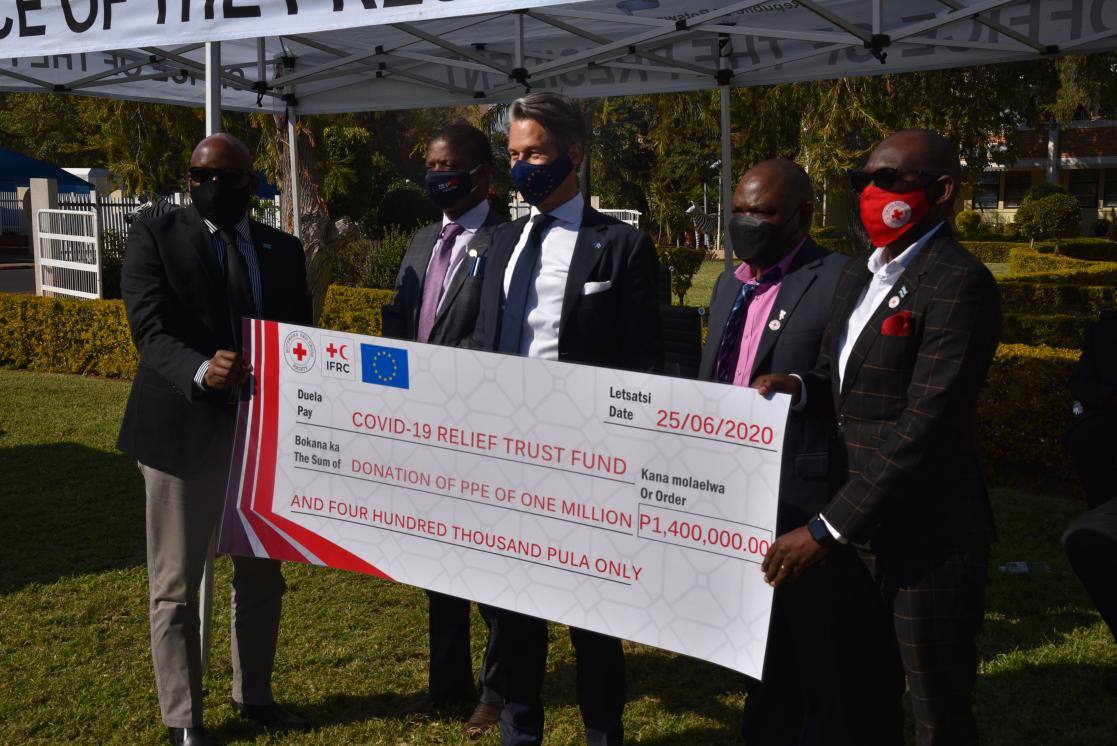 People holding a cheque