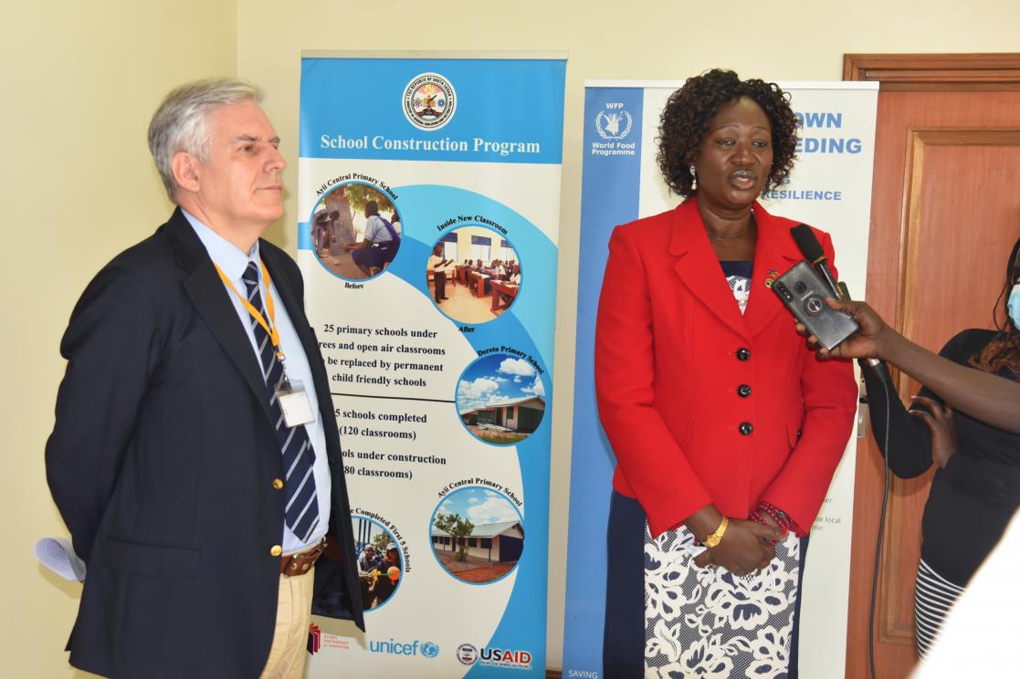 Two people attending to the media