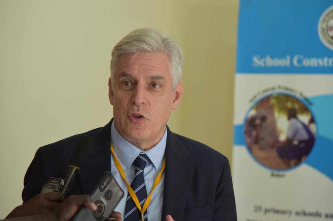 Man attending to the media