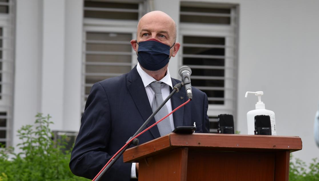 Man speaking at a lectern