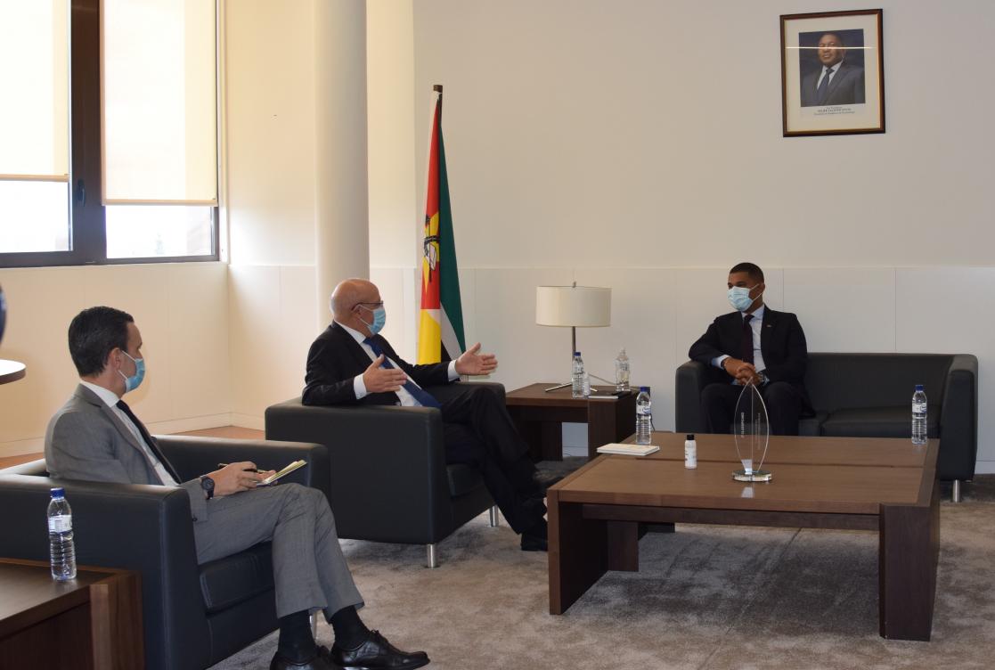 Three men in a meeting