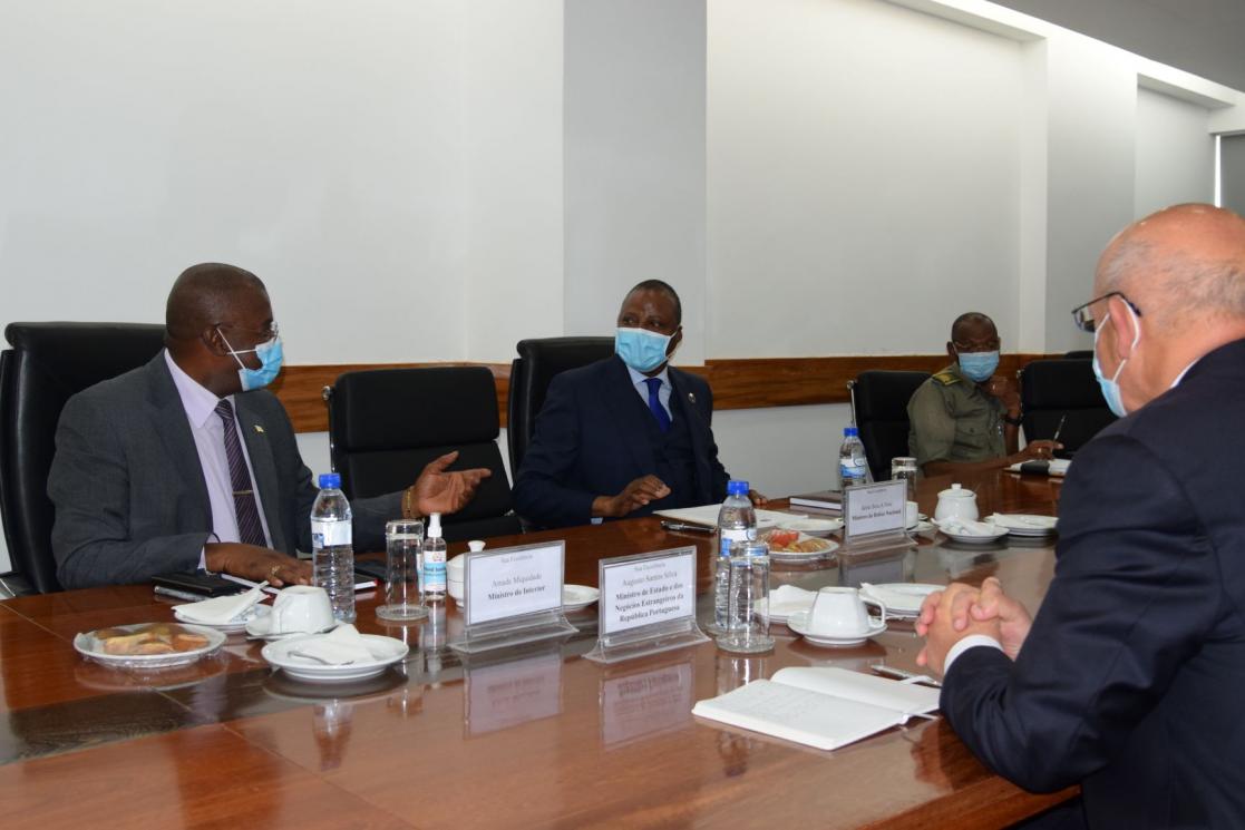 Four men in a meeting