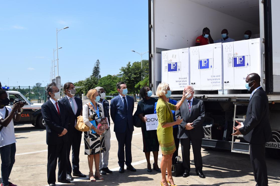 Group of people with boxes of material