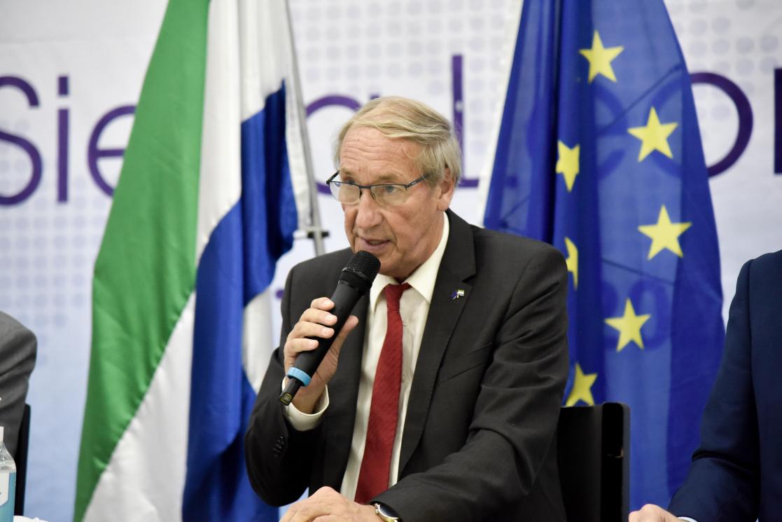 Man speaking into microphone