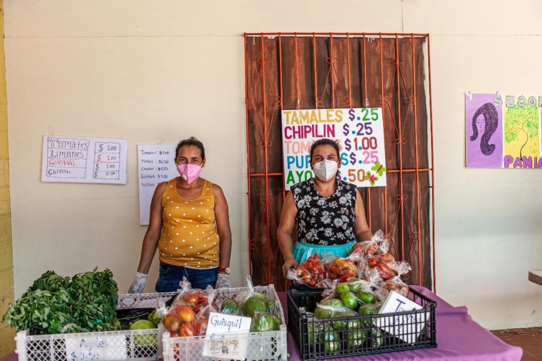 Two women with vegetables