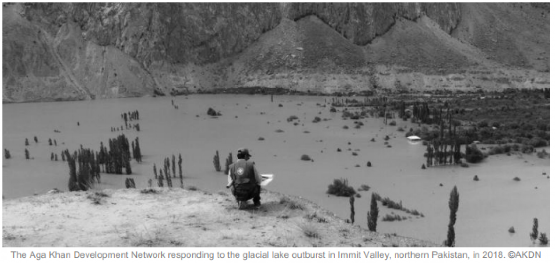 Black and white photo of a man working in a lake
