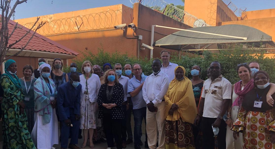 Group of people posing standing