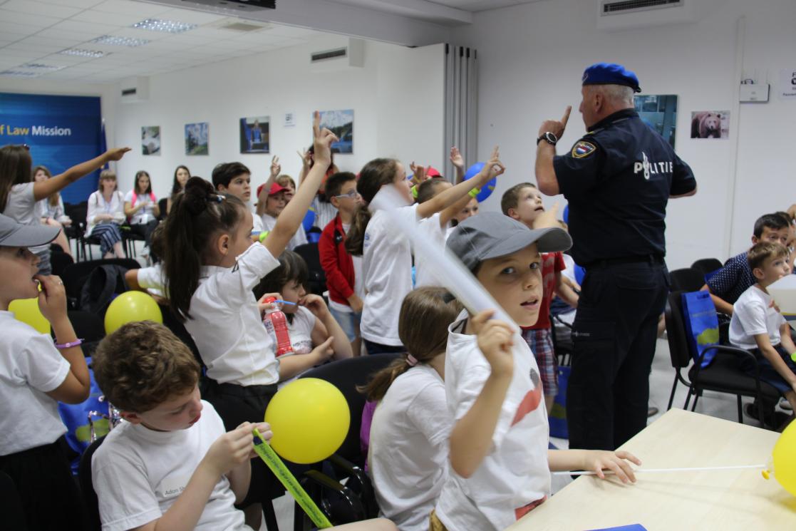 Man giving a talk at a school