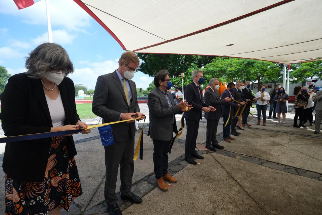 Group of people with ribbons during an institutional visit
