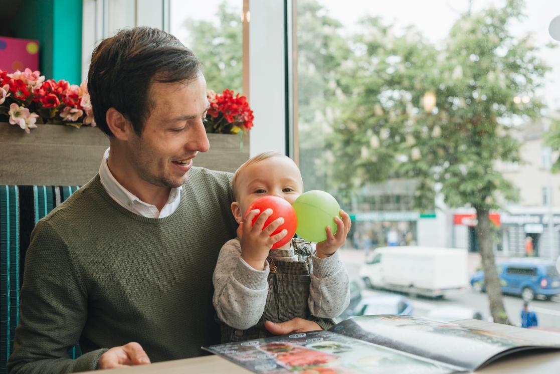 Man playing with baby