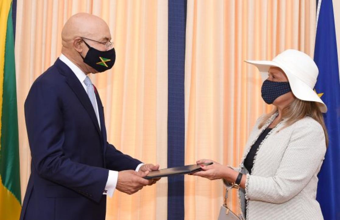 Two people exchanging documents