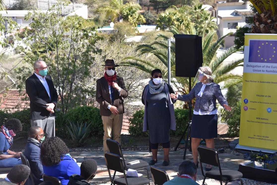 Group of people talking to an audience