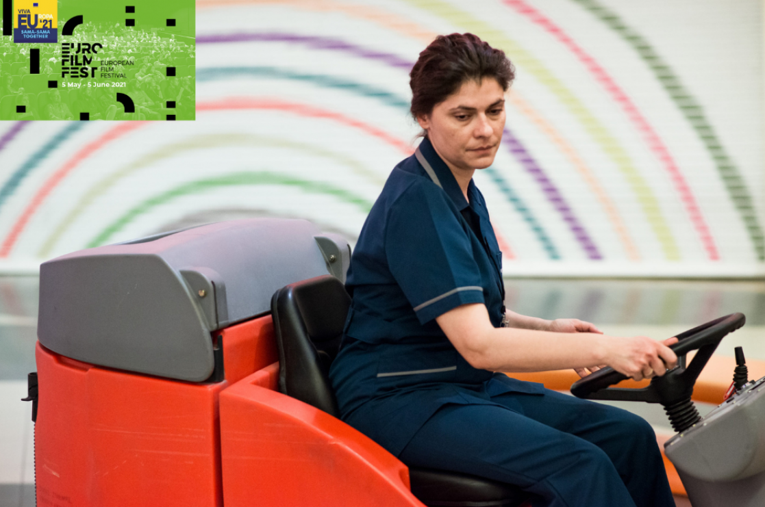Woman driving a little tractor