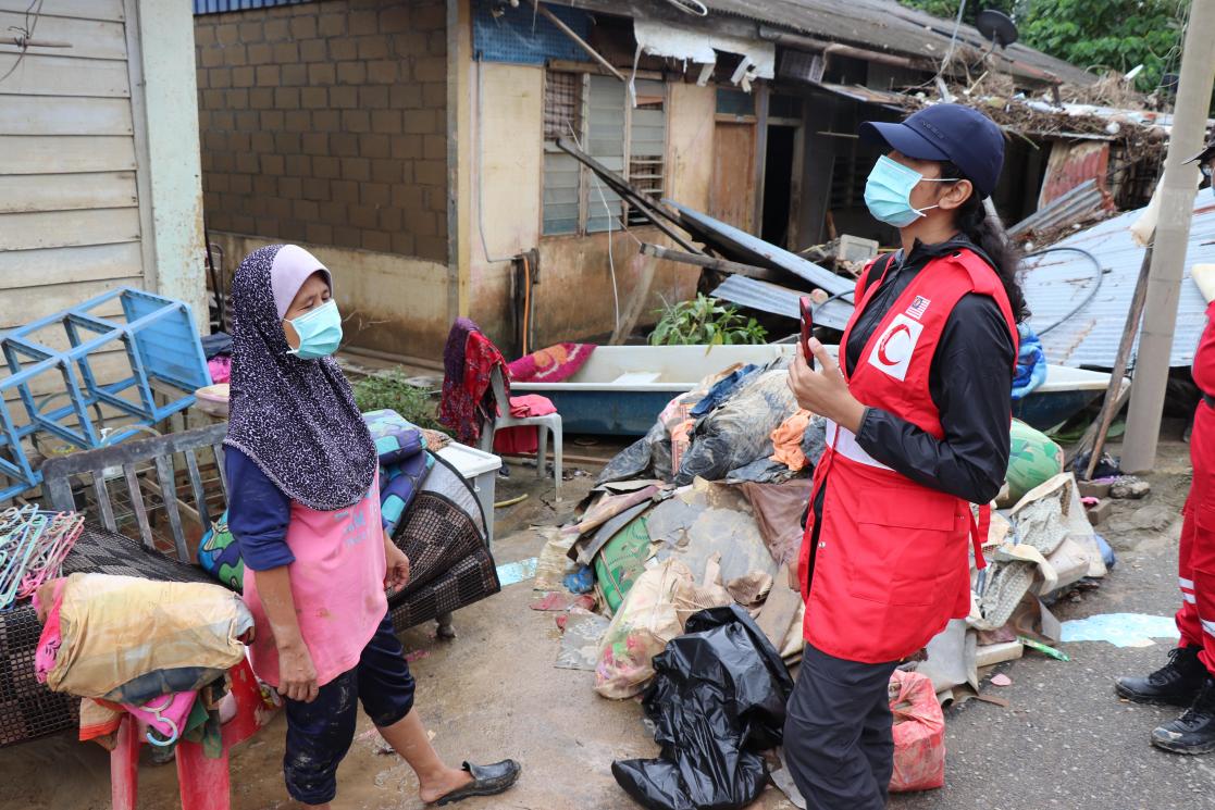 Volunteer helping a girl