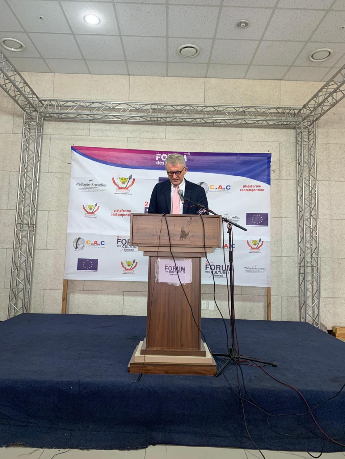 Man talking into a lectern