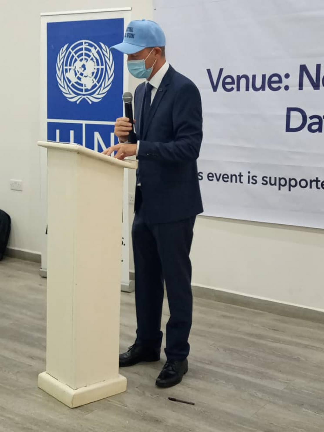 Man talking into a lectern