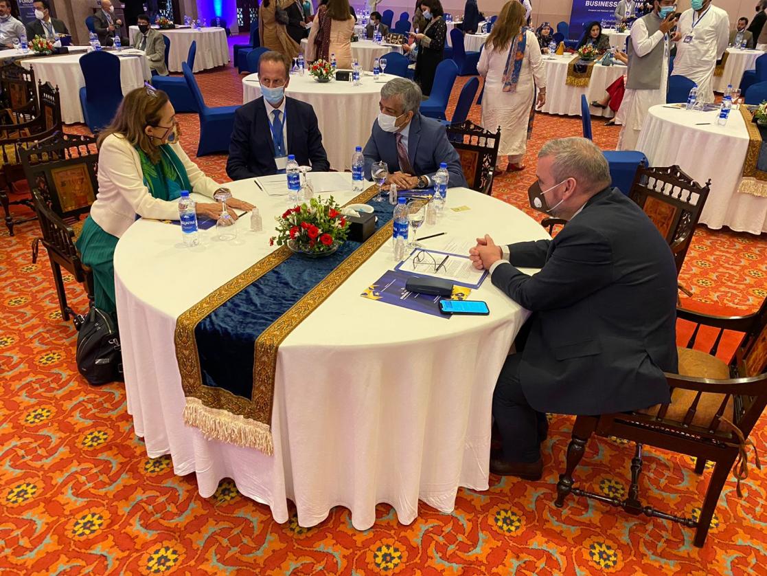 Group of people talking around a table