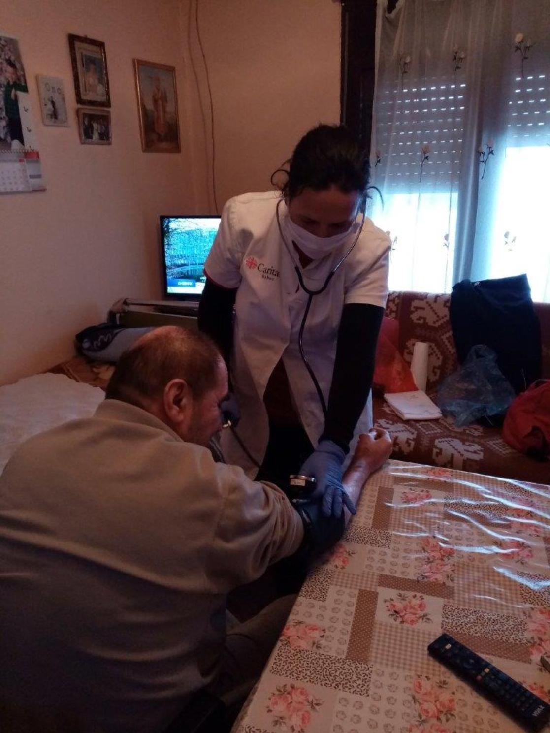 Nurse attending to a man
