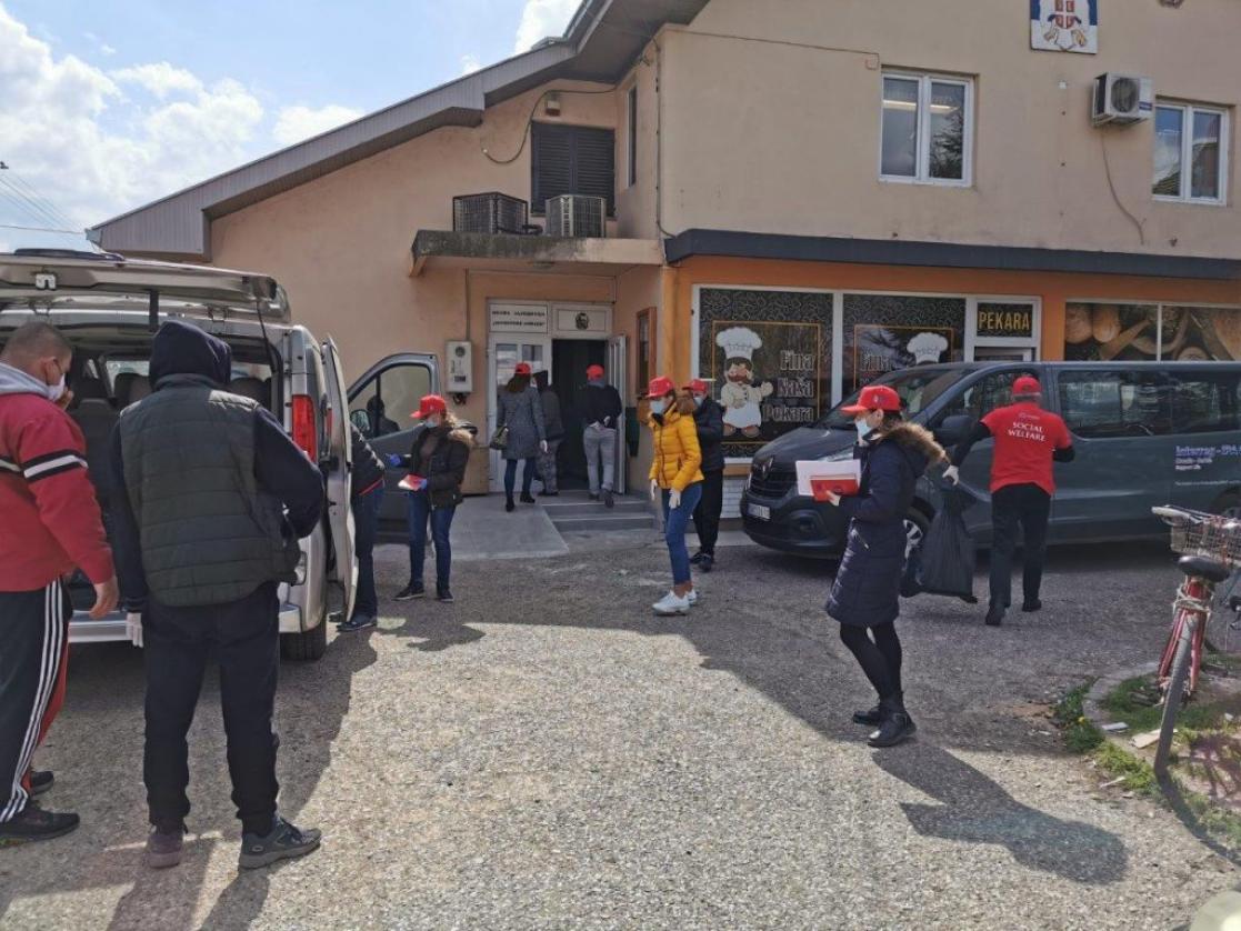 Group of people getting into a building