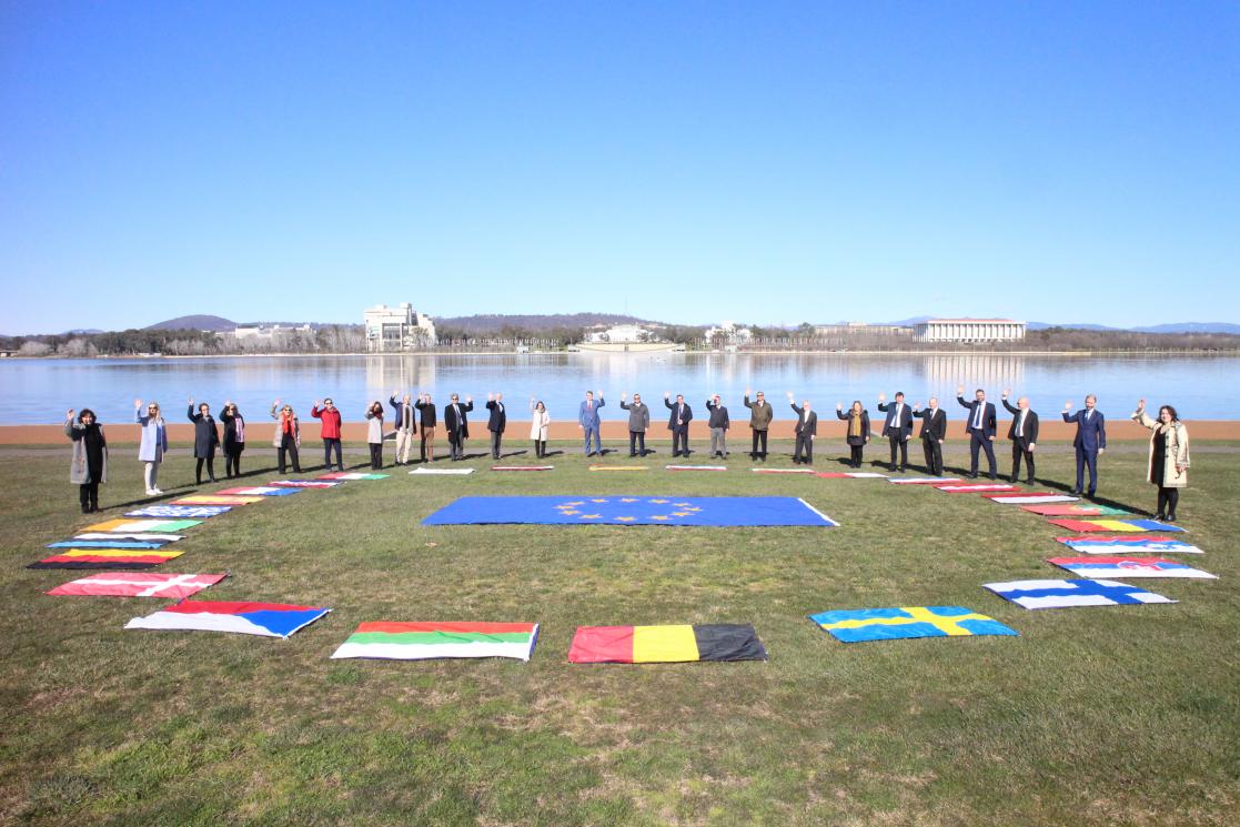 People raising hands with the European countries flags