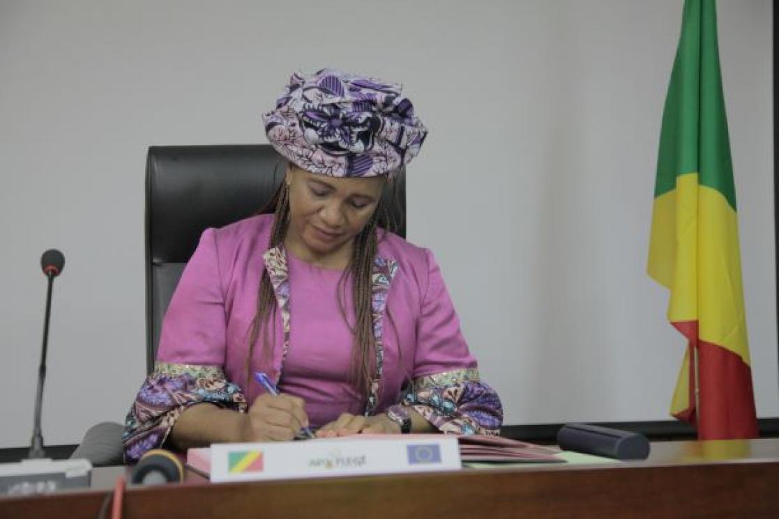 Woman signing documents