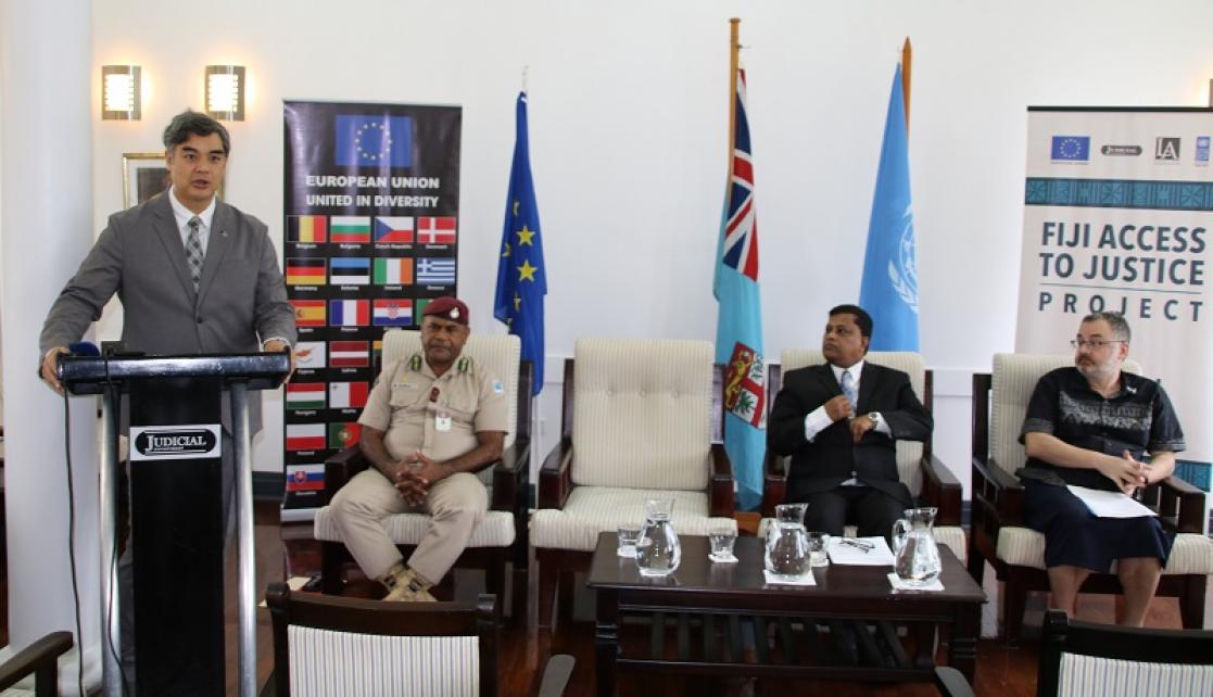 Man talking into a lectern