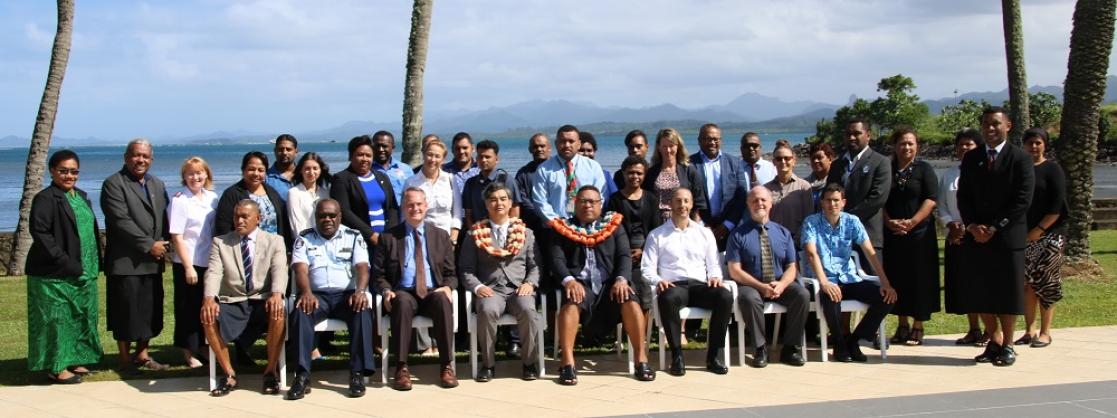 Group of people with the sea in the background