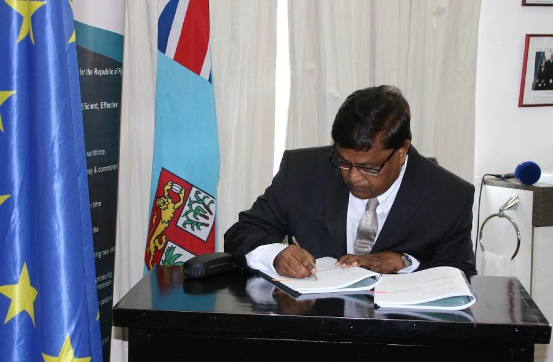 Man signing documents