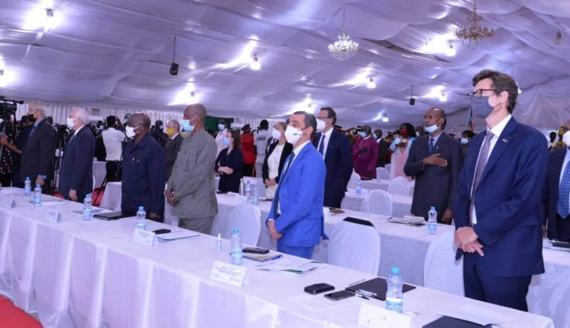 People standing up behind the table