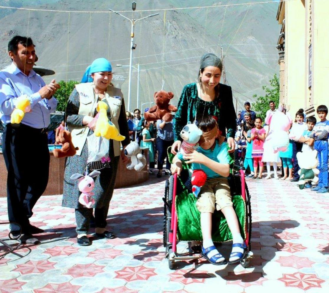 People playing with a kid