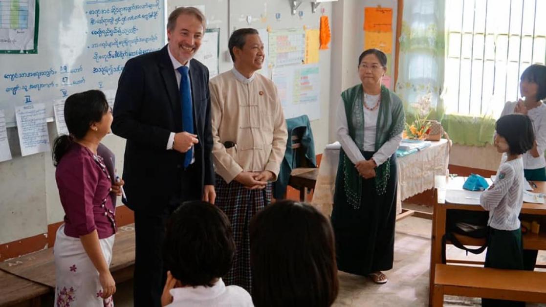 people visiting a school