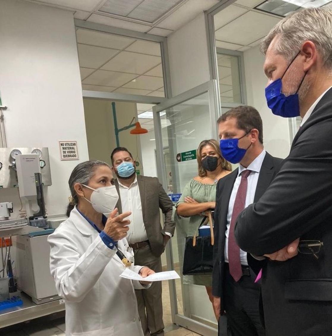 Scientist explaining something to someone else
