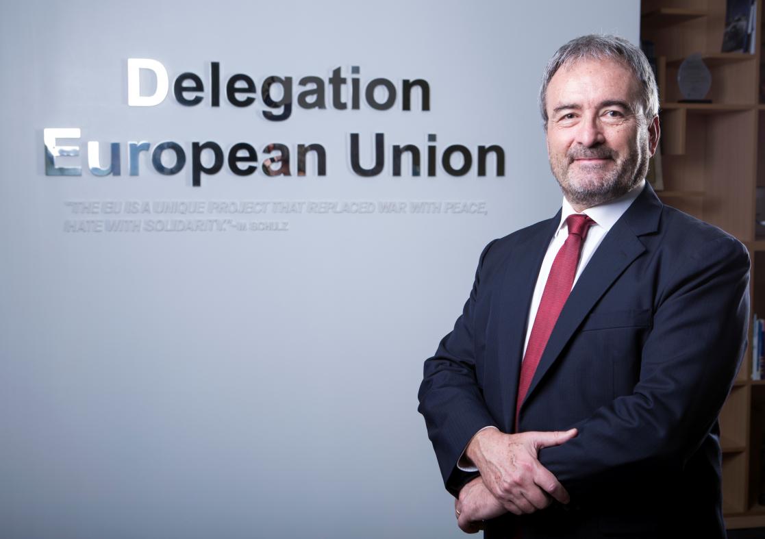 Man smiling in front of the camera