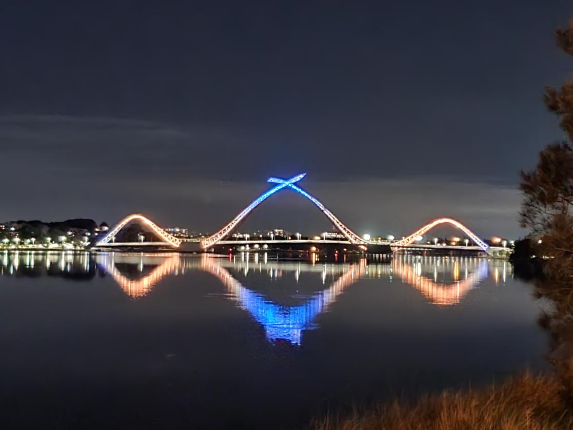 Illuminated bridge at night