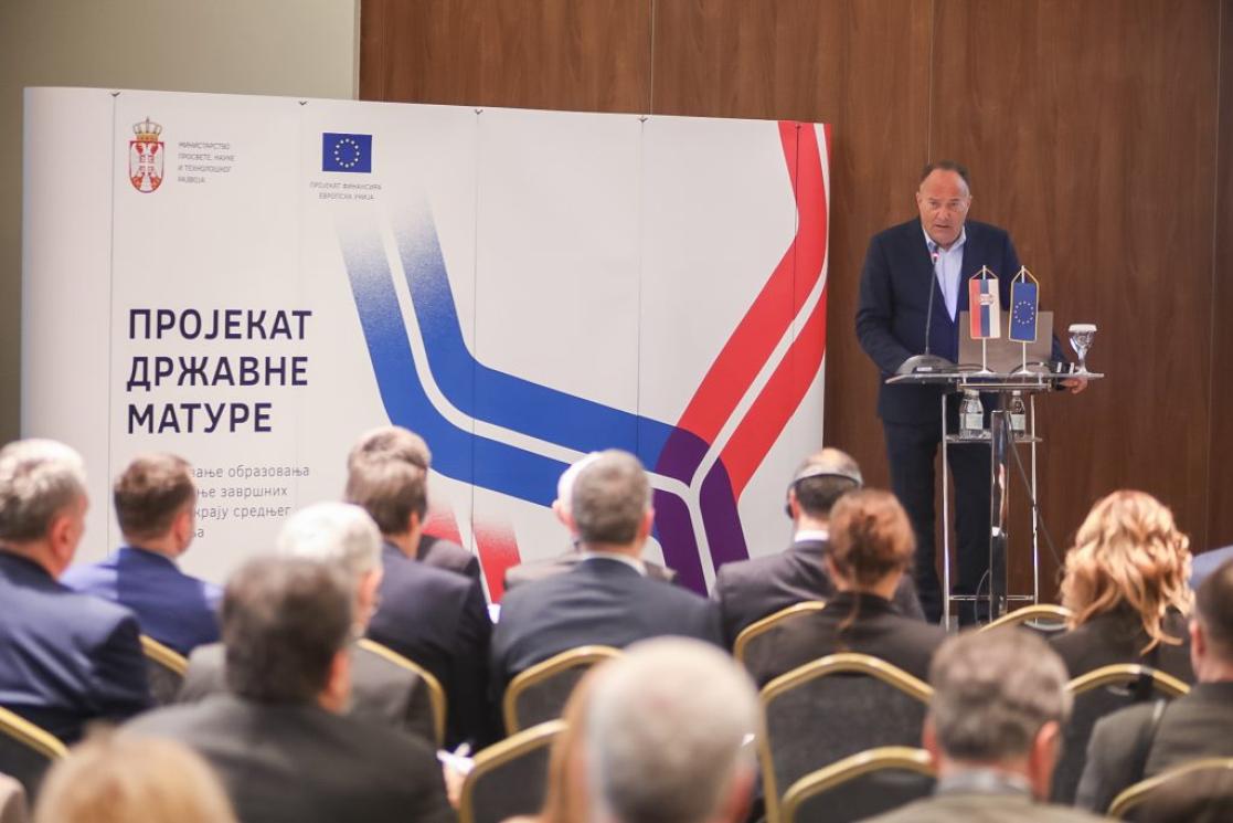 Man talking into a lectern