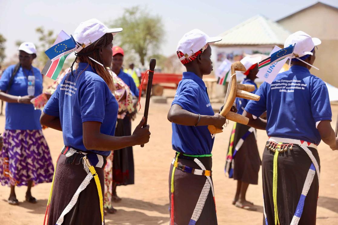 Women dancing to welcome the EU, UNOPS Delegation