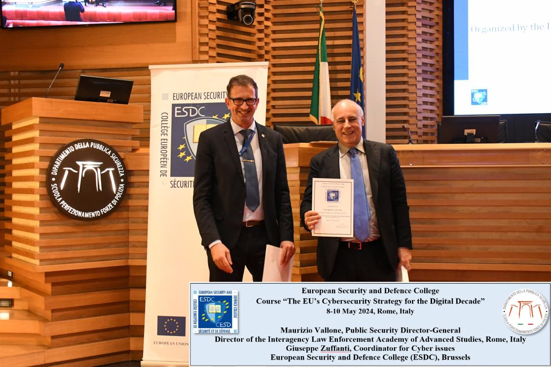 Maurizio Vallone and Giuseppe Zufanti holding a document