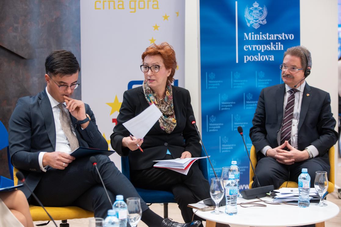 Vice-President of Parliament Zdenka Popović sitting and holding a paper on her left side is Minister Šaranović and on the right side is ambassador of Germany Felten